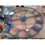 A DECORATIVE METAL WALL CLOCK