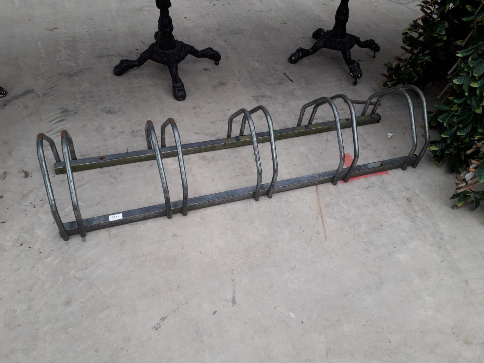 A FIVE SECTION METAL BIKE STAND