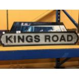 A WOODEN KINGS ROAD SIGN