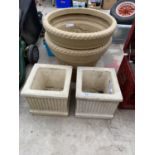 A PAIR OF SMALL RECONSTITUTED STONE PLANTERS AND A FURTHER PAIR OF ROUND PLASTIC PLANTERS