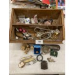 A WOODEN BOX WITH A QUANTITY OF ITEMS TO INCLUDE COSTUME JEWELLERY, PEN KNIVES, FIGURES, LIGHTERS