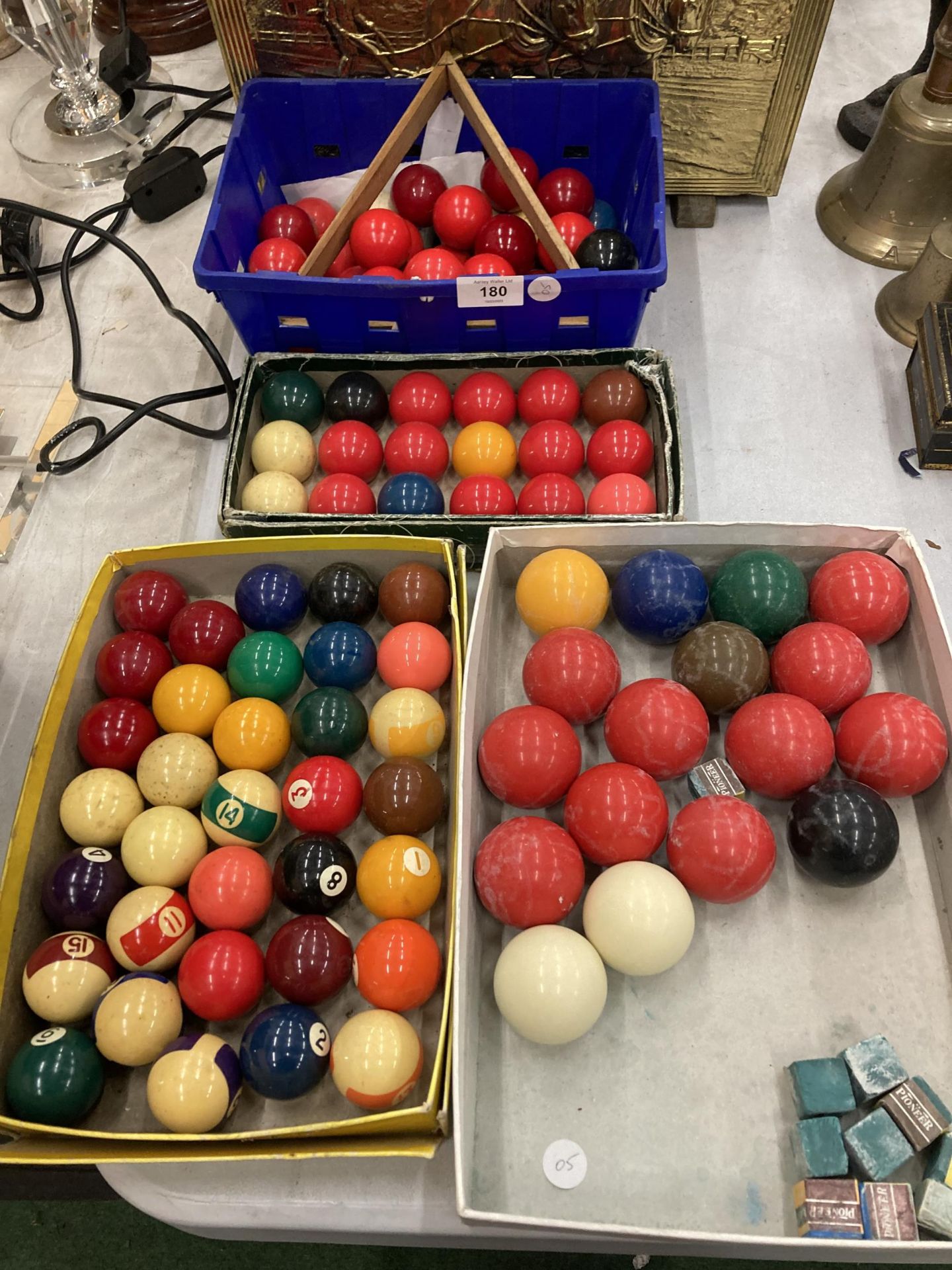 A LARGE QUANTITY OF SNOOKER AND POOL BALLS WITH A TRIANGLE AND CHALK