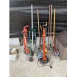 AN ASSORTMENT OF GARDEN TOOLS TO INCLUDE A FLYMO STRIMMER, SPADE, ETC