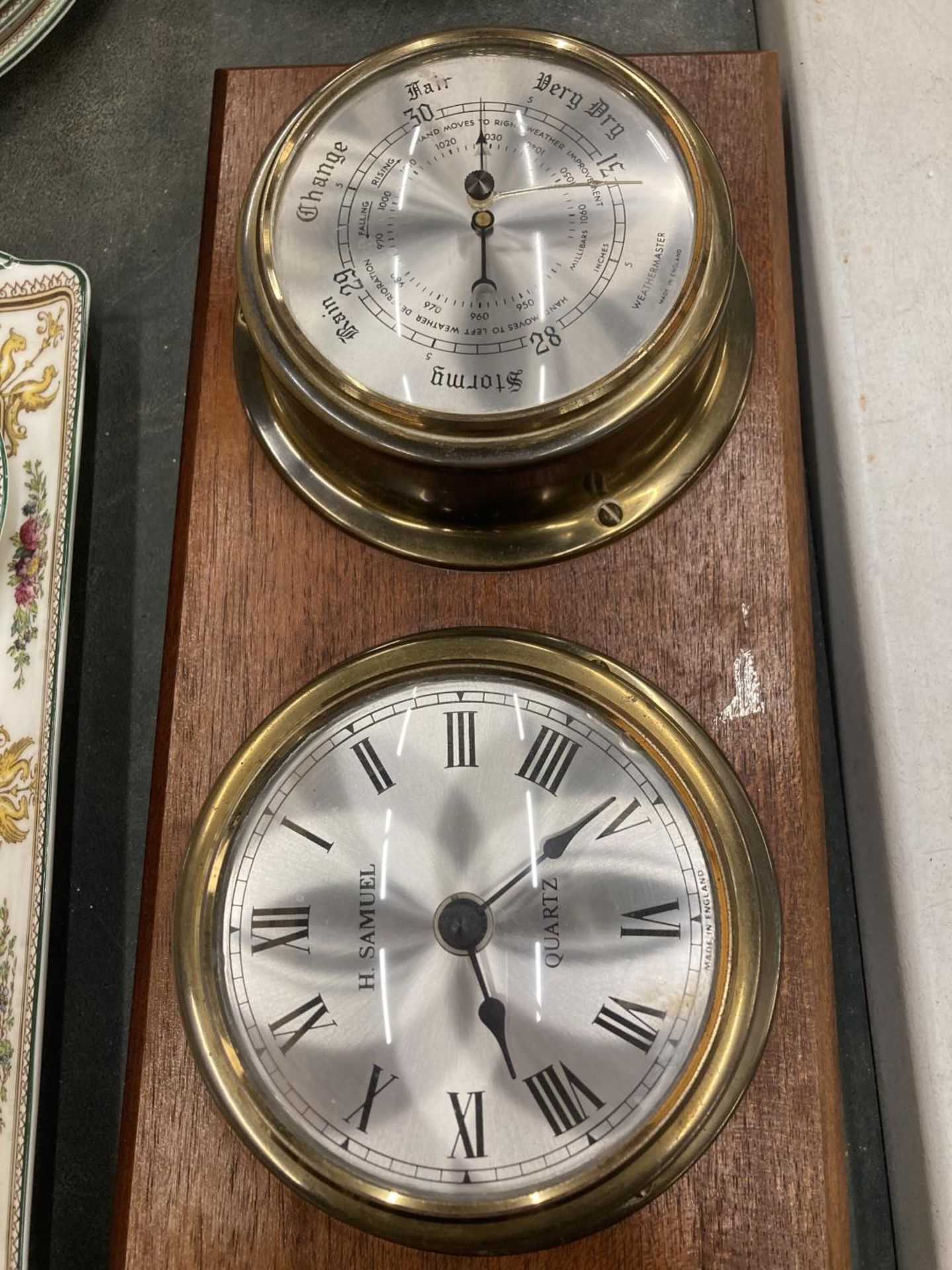 TWO BRASS BAROMETERS AND CLOCKS MOUNTED ON WOODEN PLINTHS - Image 2 of 3
