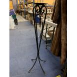 A HEAVY METAL TALL CANDLE HOLDER HEIGHT 98CM