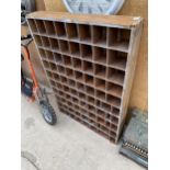 A VINTAGE WOODEN EIGHTY SECTION PIGEON HOLE UNIT