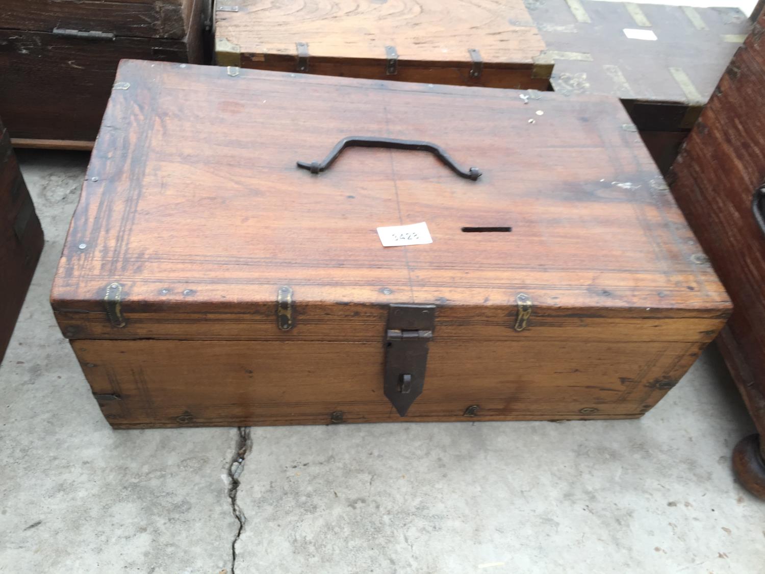 AN INDIAN HARDWOOD BOX WITH BRASS STRAP + IRONWORK HANDLE + CLASP