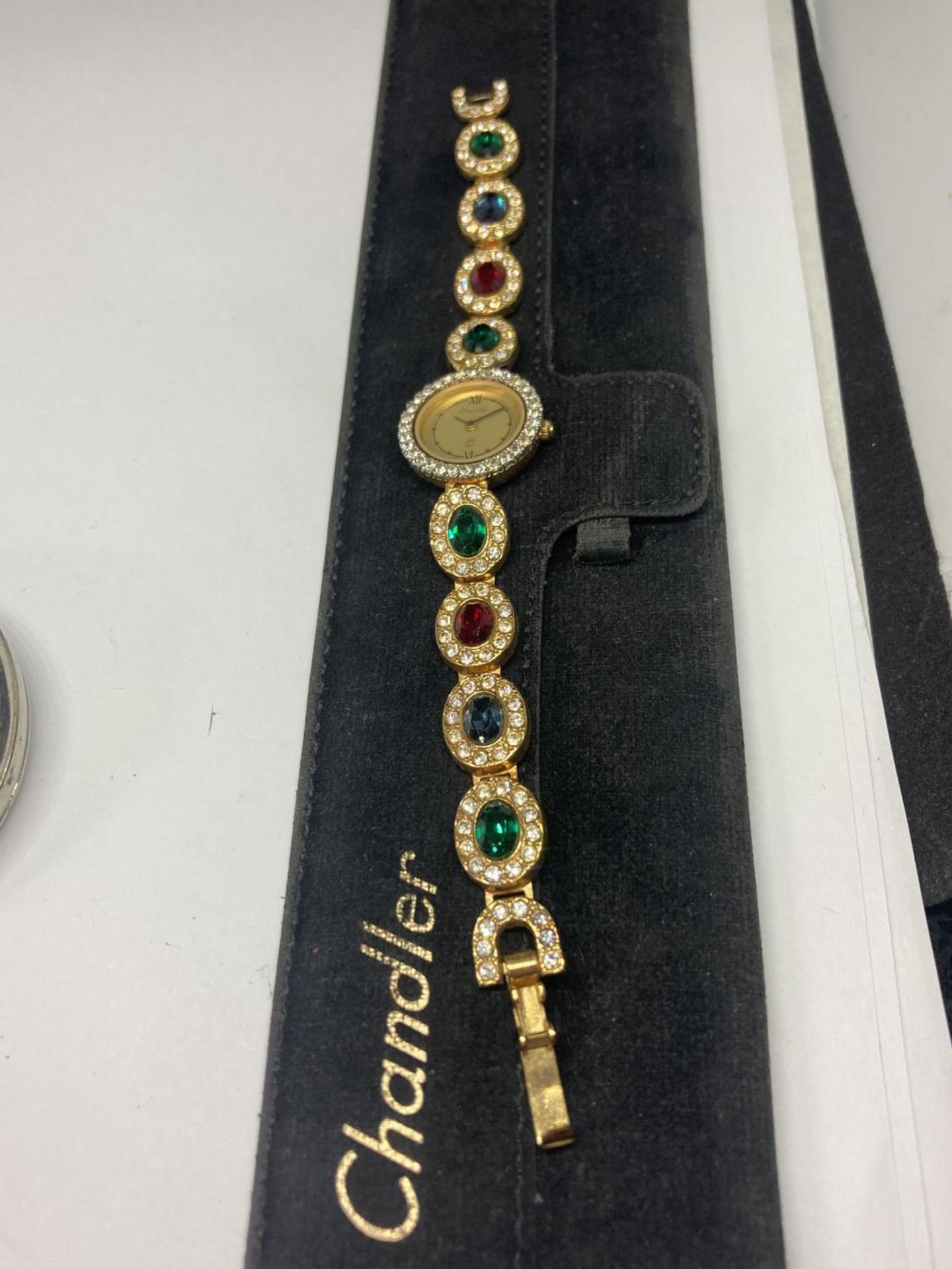 A LADIES CHANDLER JEWELLED WATCH WITH ORIGINAL POUCH