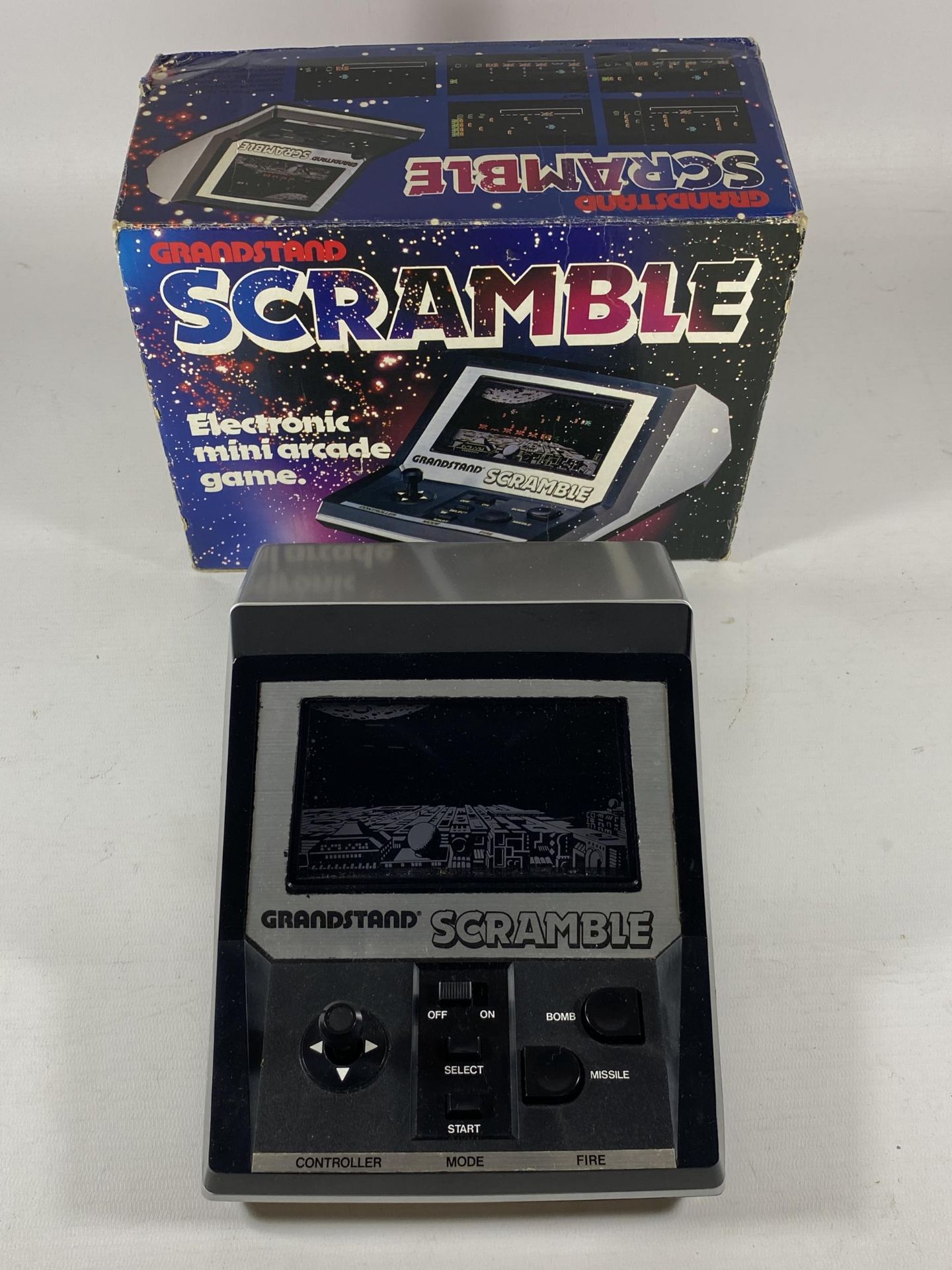 A RETRO BOXED GRANDSTAND SCRAMBLE ELECTRONIC MINI ARCADE GAME