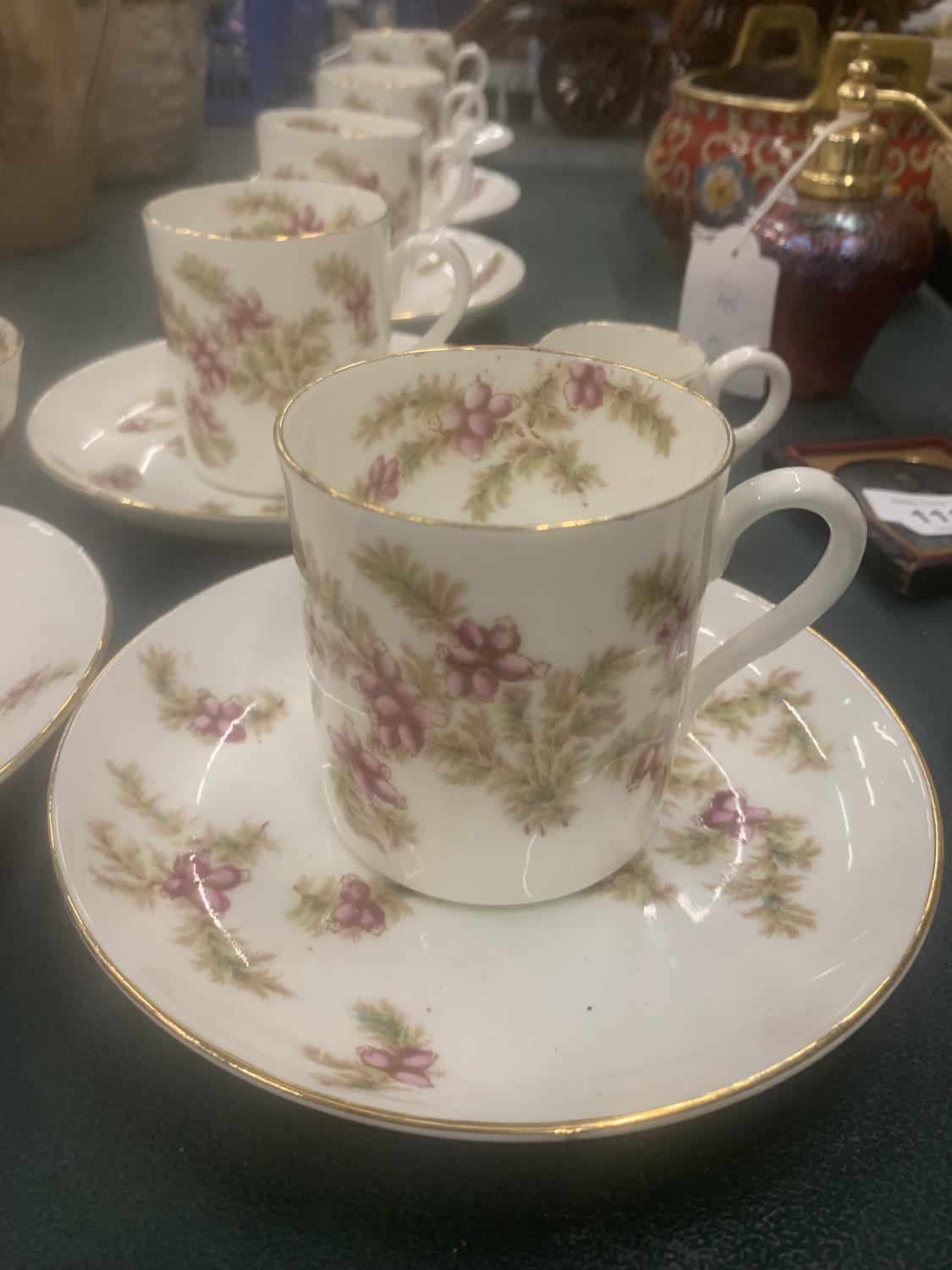 A VINTAGE CHINA PART TEASET WITH PINK FLORAL PATTERN TO INCLUDE CUPS, SAUCERS, CREAM JUG AND A SUGAR - Image 2 of 4