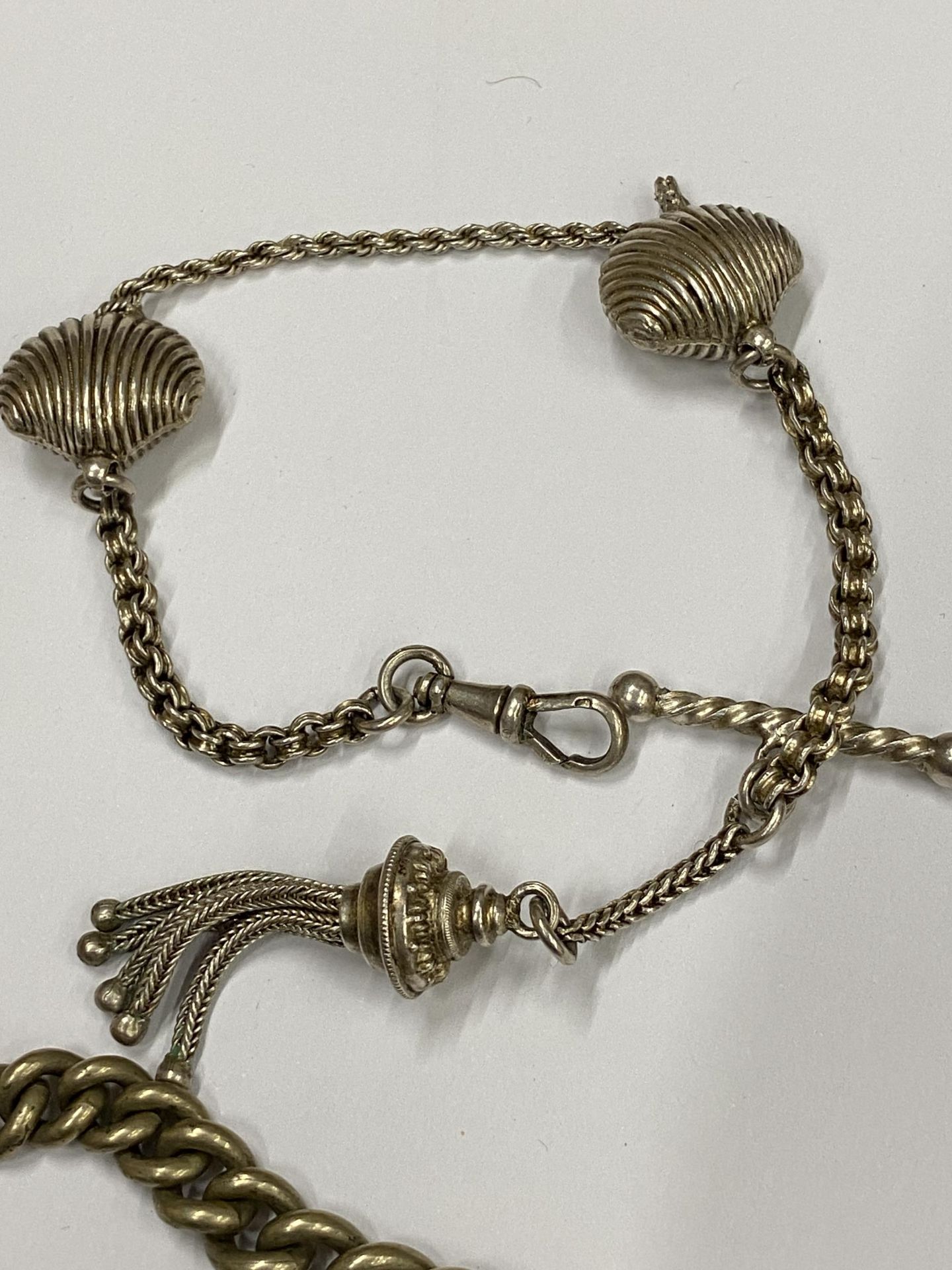 TWO VINTAGE SILVER PLATED ALBERT CHAINS TO INCLUDE A FANCY SHELL DESIGN EXAMPLE - Image 3 of 3