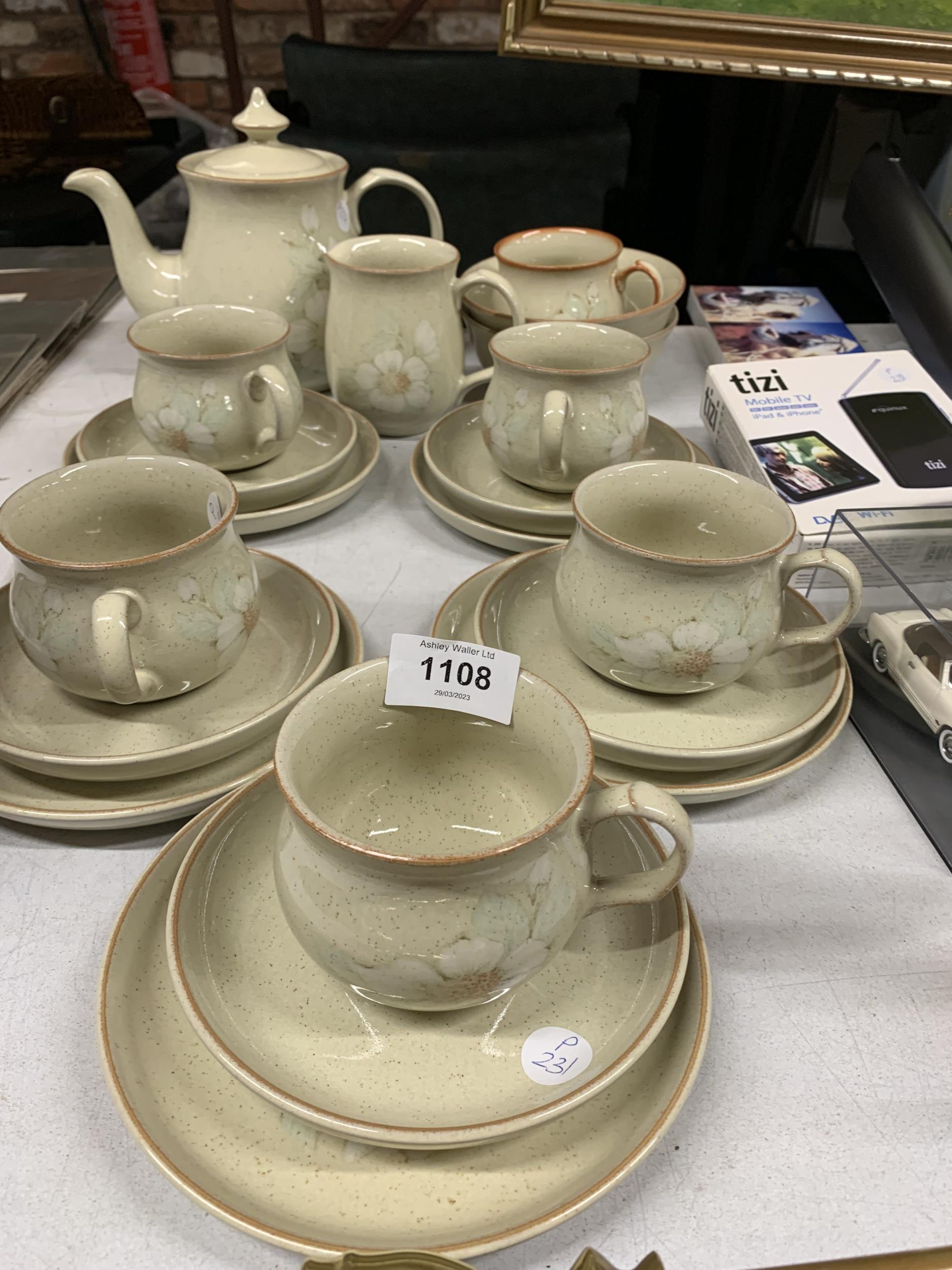 A DENBY TEASET TO INCLUDE A TEAPOT, CREAM JUG, BOWLS, CUPS, SAUCERS AND SIDE PLATES