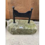 A METAL BOOT SCRAPER SET IN A PIECE OF YORK STONE