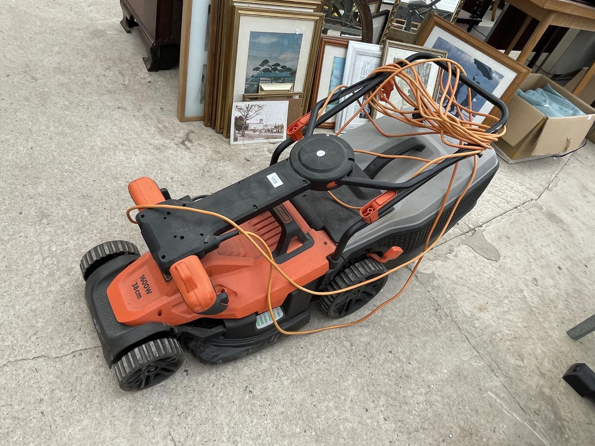 A BLACK AND DECKER ELECTRIC LAWN MOWER WITH GRASS BOX