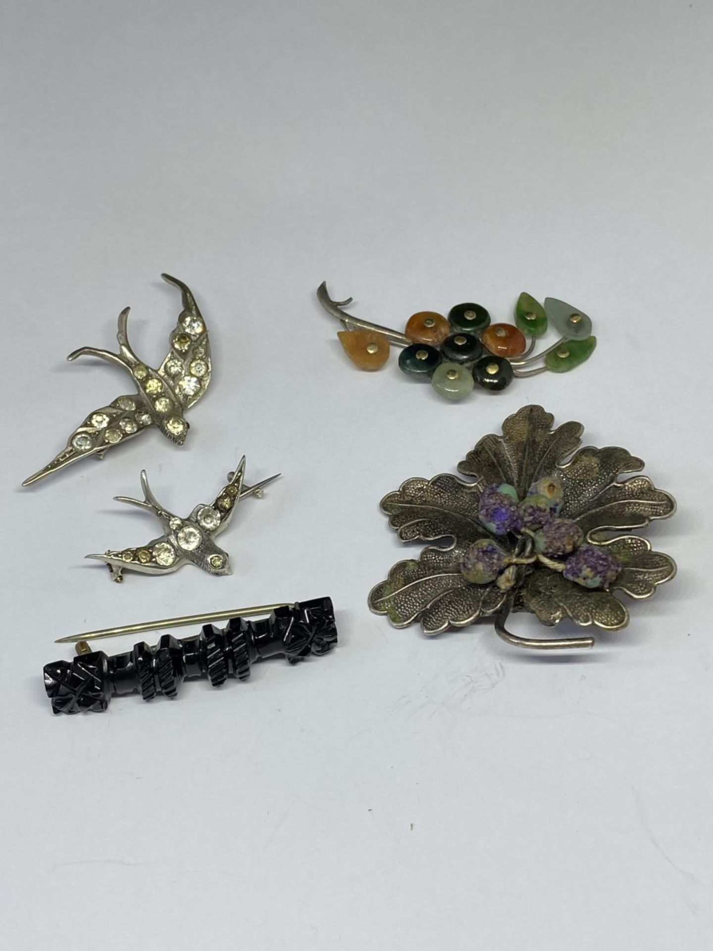 FIVE VARIOUS SILVER BROOCHES