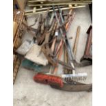 A LARGE ASSORTMENT OF GARDEN TOOLS TO INCLUDE SYTHES AND SHEARS ETC