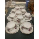 A COLCLOUGH TEASET WITH ROSE PATTERN TO INCLUDE CUPS, SAUCERS, SIDE PLATES, A CAKE PLATE, CREAM