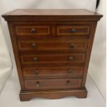 AN EDWARDIAN INLAID MAHOGANY APPRENTICE CHEST OF DRAWERS COMPRISING TWO SHORT OVER FOUR LONG