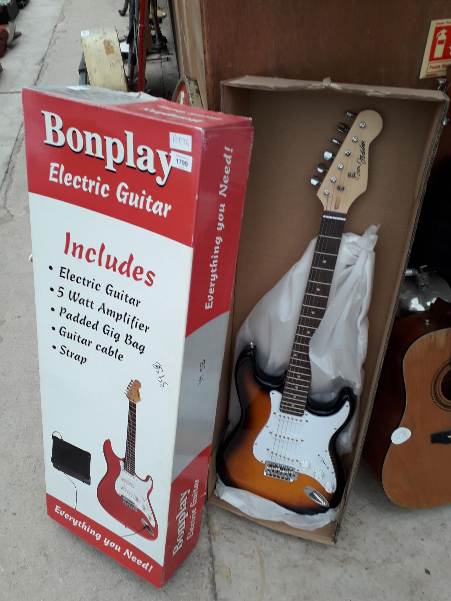 AN AS NEW AND BOXED BONPLAY ELECTRIC GUITAR