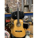 AN ENCORE CHILD'S ACOUSTIC GUITAR WITH STAND AND CASE