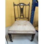 AN EDWARDIAN INLAID BEDROOM CHAIR ON CASTORS