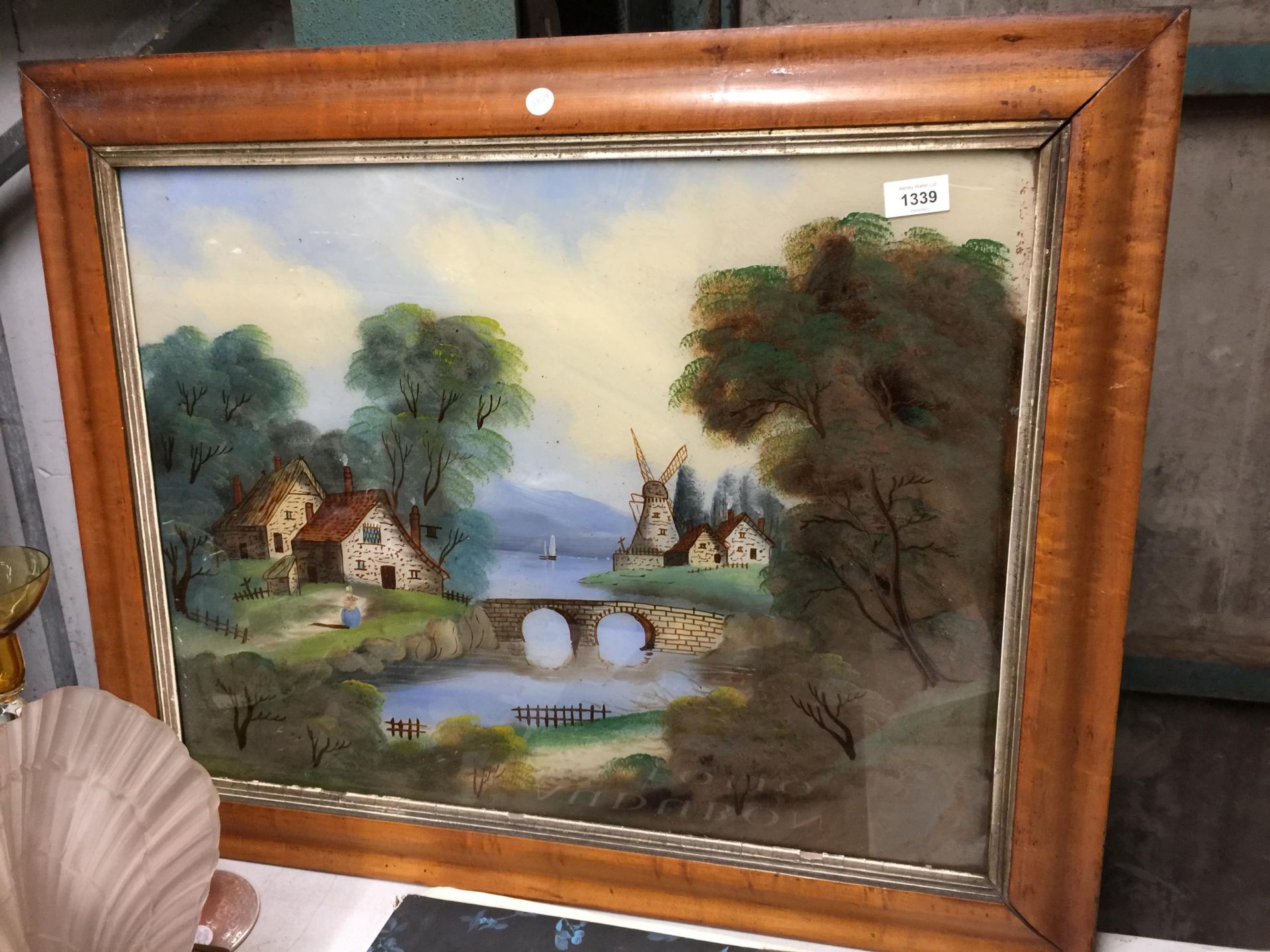 AN OIL ON GLASS PAINTING OF A CONTINENTAL SCENE IN A WOODEN FRAME 79CM X 64CM