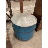 A VINTAGE METAL DRUM SEAT WITH WOODEN TOP