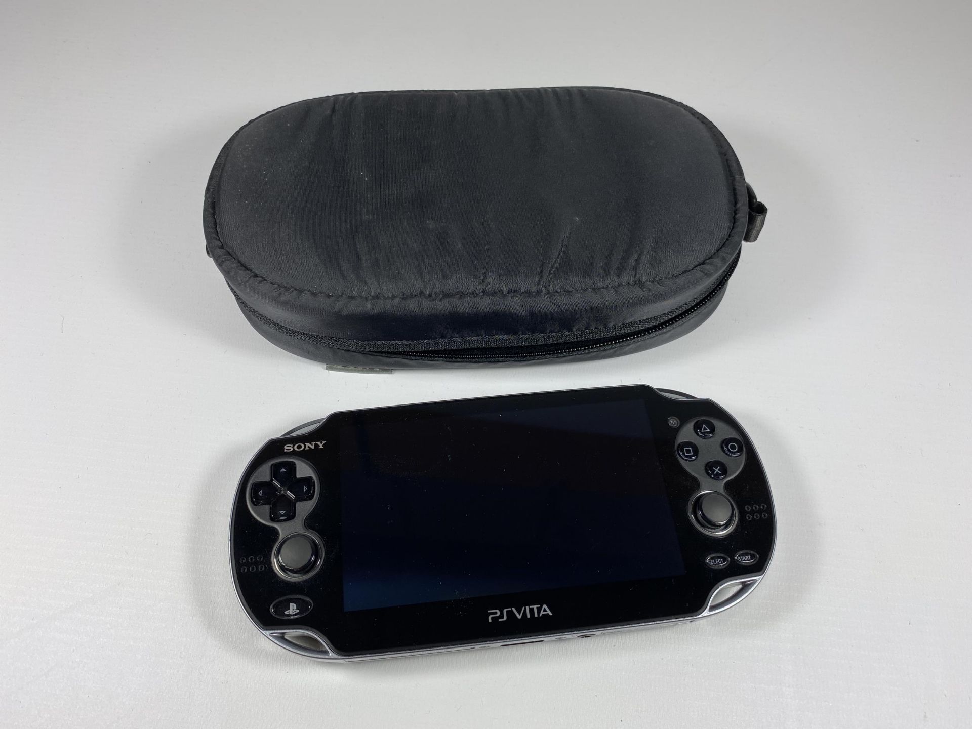 A PS VITA CONSOLE AND CASE