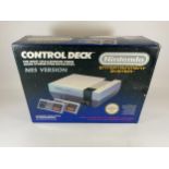A BOXED RETRO NINTENDO CONTROL DECK NES VERSION ENTERTAINMENT SYSTEM CONSOLE