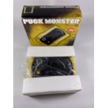 A BOXED RETRO CGL PUCK MONSTER ARCADE GAME
