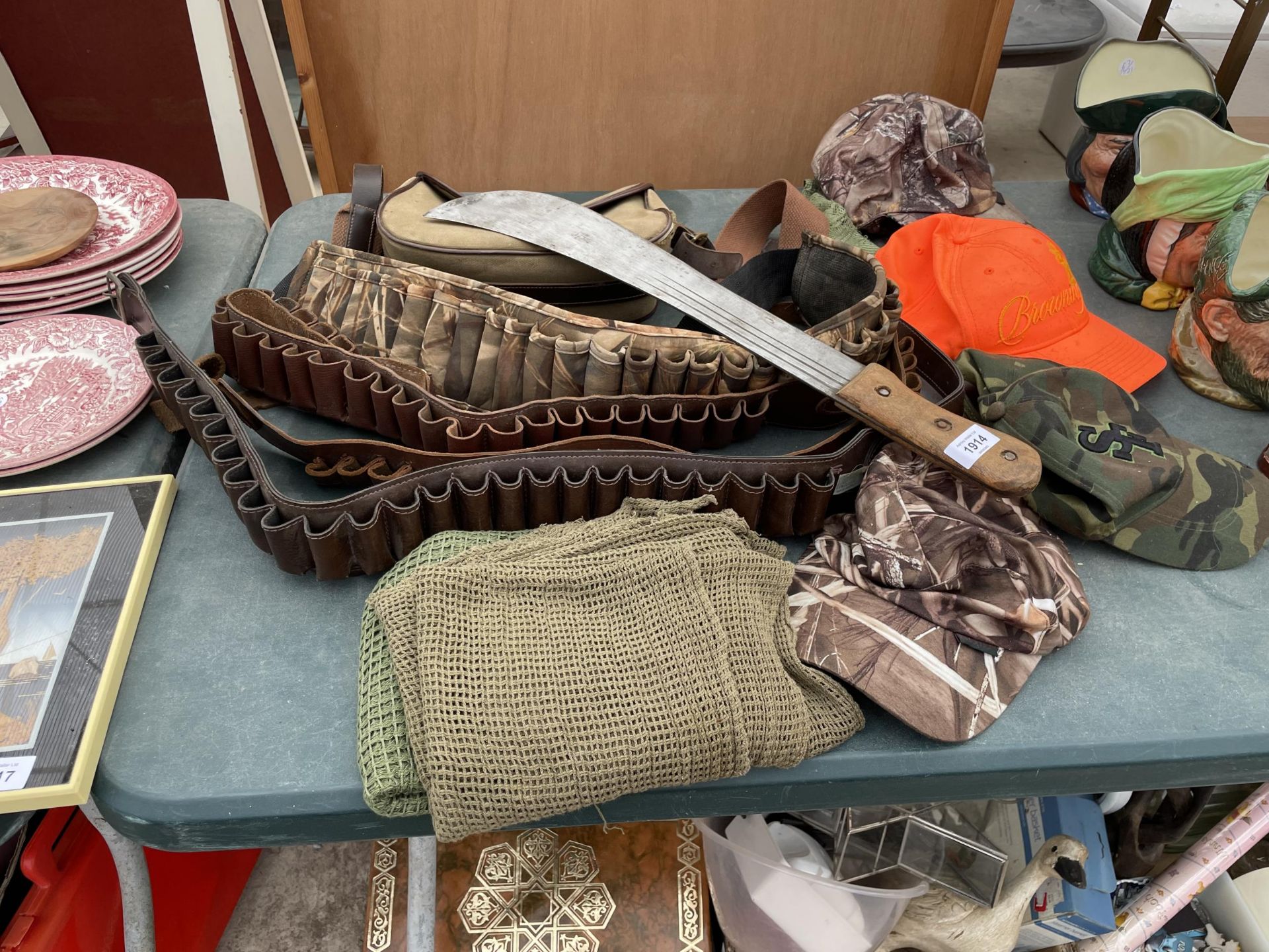 A COLLECTION OF MILITARY ITEMS TO INCLUDE, CARTRIDGE BELTS, HATS, BAG, ETC