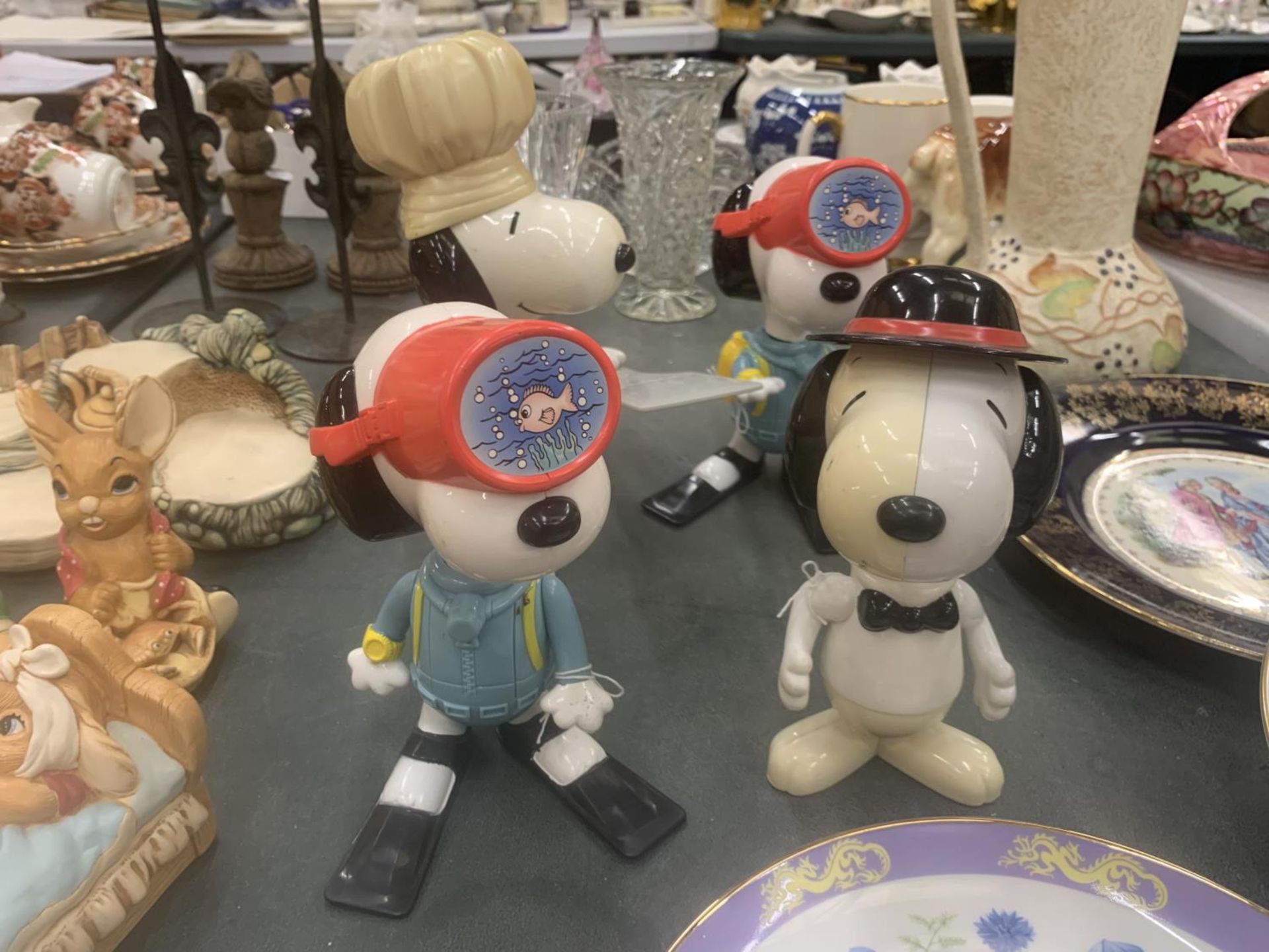 FOUR VINTAGE McDONALD'S SNOOPY MODELS