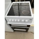 A WHITE BEKO FREESTANDING ELECTRIC OVEN AND HOB BELIEVED WORKING BUT NO WARRANTY