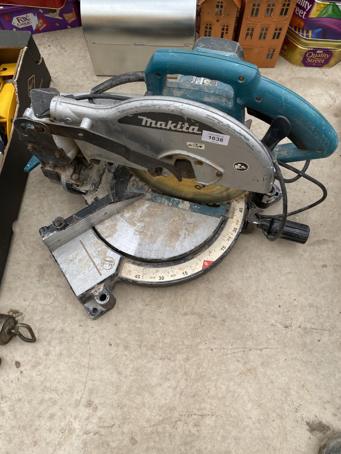 AN ELECTRIC MAKITA MITRE SAW