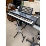 A YAMAHA ELECTRIC KEYBOARD AND STAND