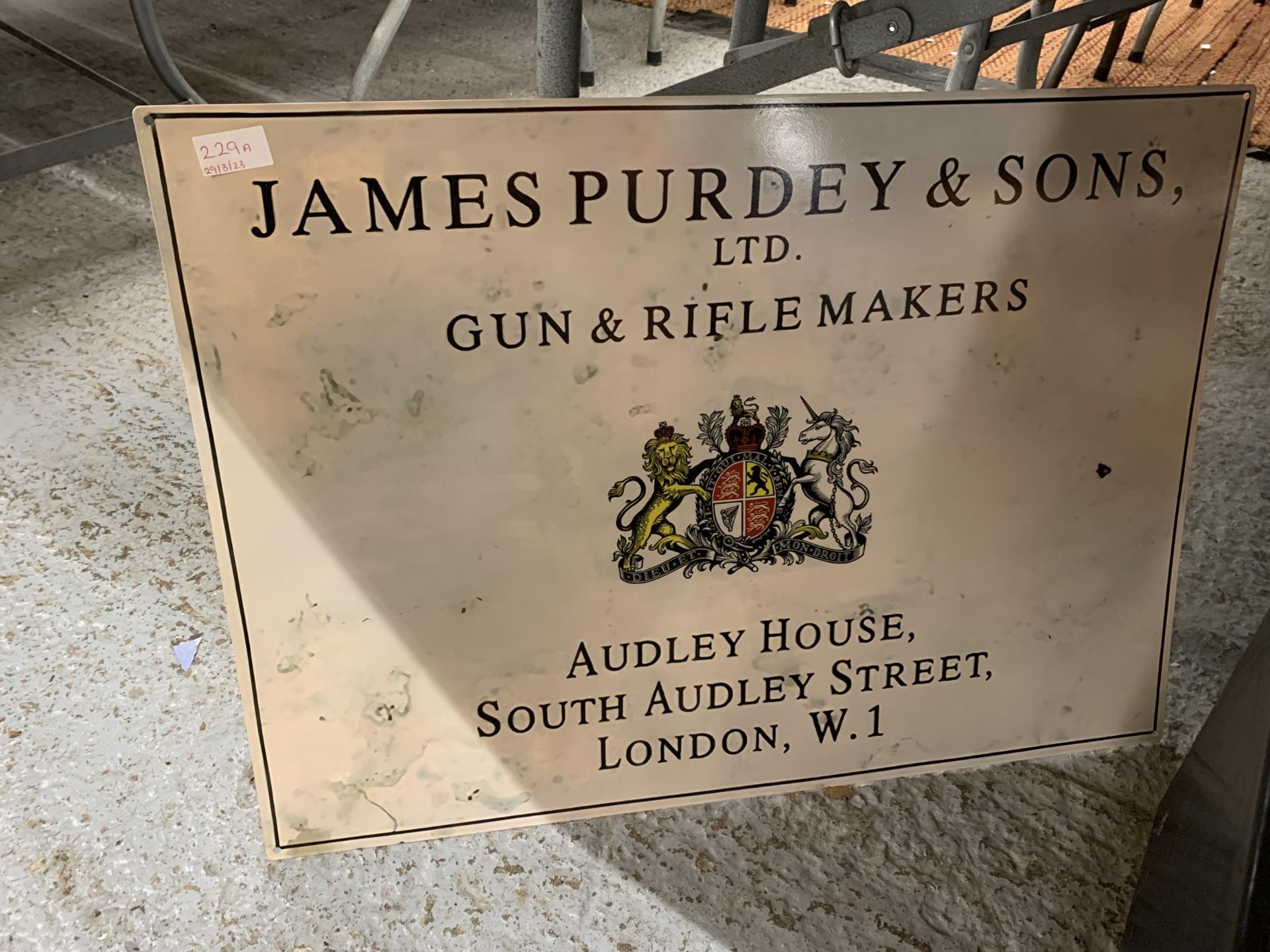 A JAMES PURDEY & SONS GUN & RIFLE MAKERS TIN SIGN 70CM X 50CM