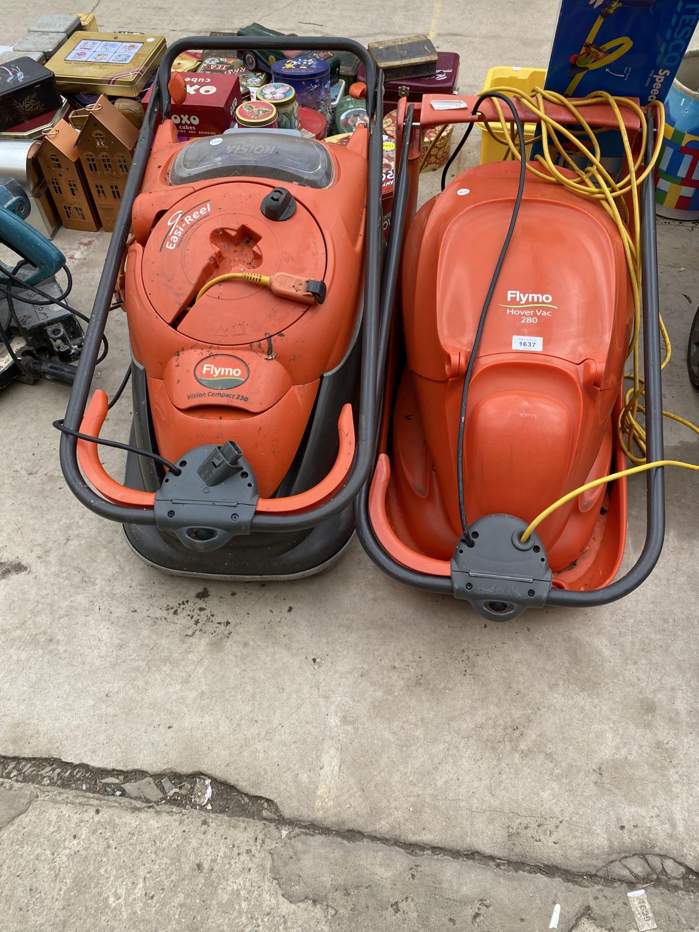 TWO ELECTRIC FLYMO HOVER MOWERS