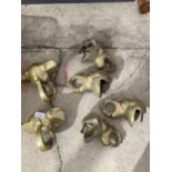 A GROUP OF BRASS ANIMAL CURTAIN POLL HOLDERS