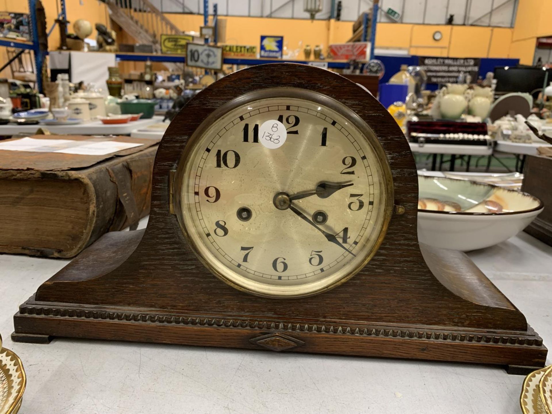A VINTAGE MAHOGANY CASED NAPO;EON'S HAT STYLE MANTLE CLOCK, WORKING AT TIME OF CATALOGUING WITH