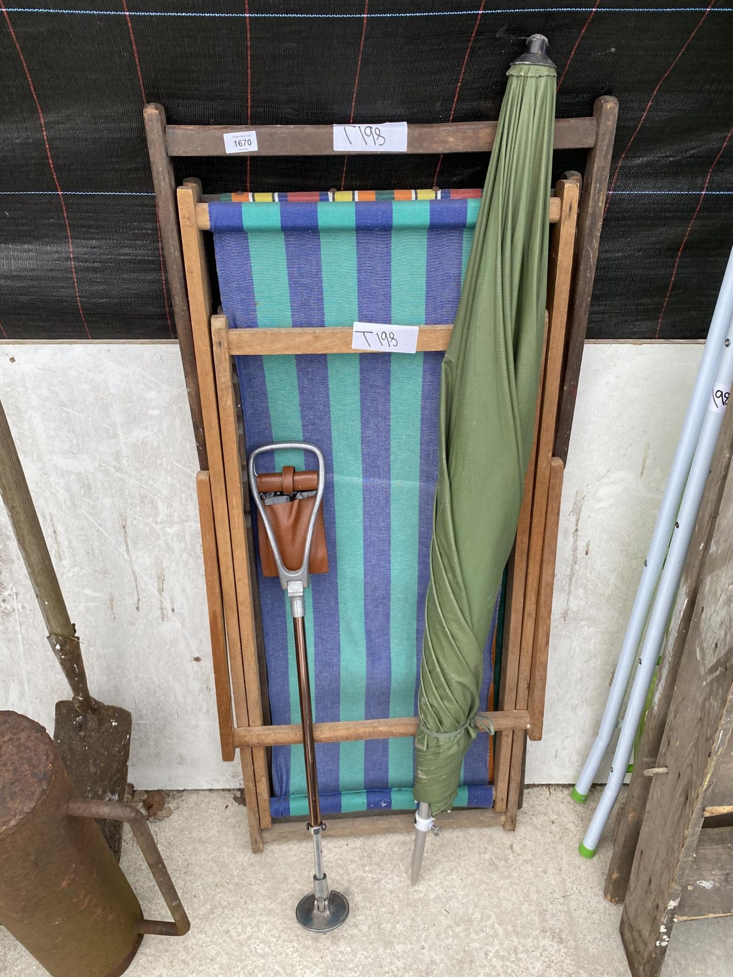 TWO TEAK FOLDING DECK CHAIRS, A FISHING BROLLY AND A STICK SEAT