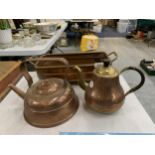 A COPPER AND BRASS PLANTER WITH TWO SMALL COPPER KETTLES