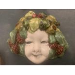 A VINTAGE PORCELAIN MASK WITH VINE AND GRAPE DECORATION - POSSIBLY ITALIAN