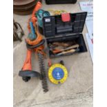 AN ASSORTMENT OF TOOLS TO INCLUDE SAWS, AN ELECTRIC HEDGE TRIMMER AND A GRASS STRIMMER ETC