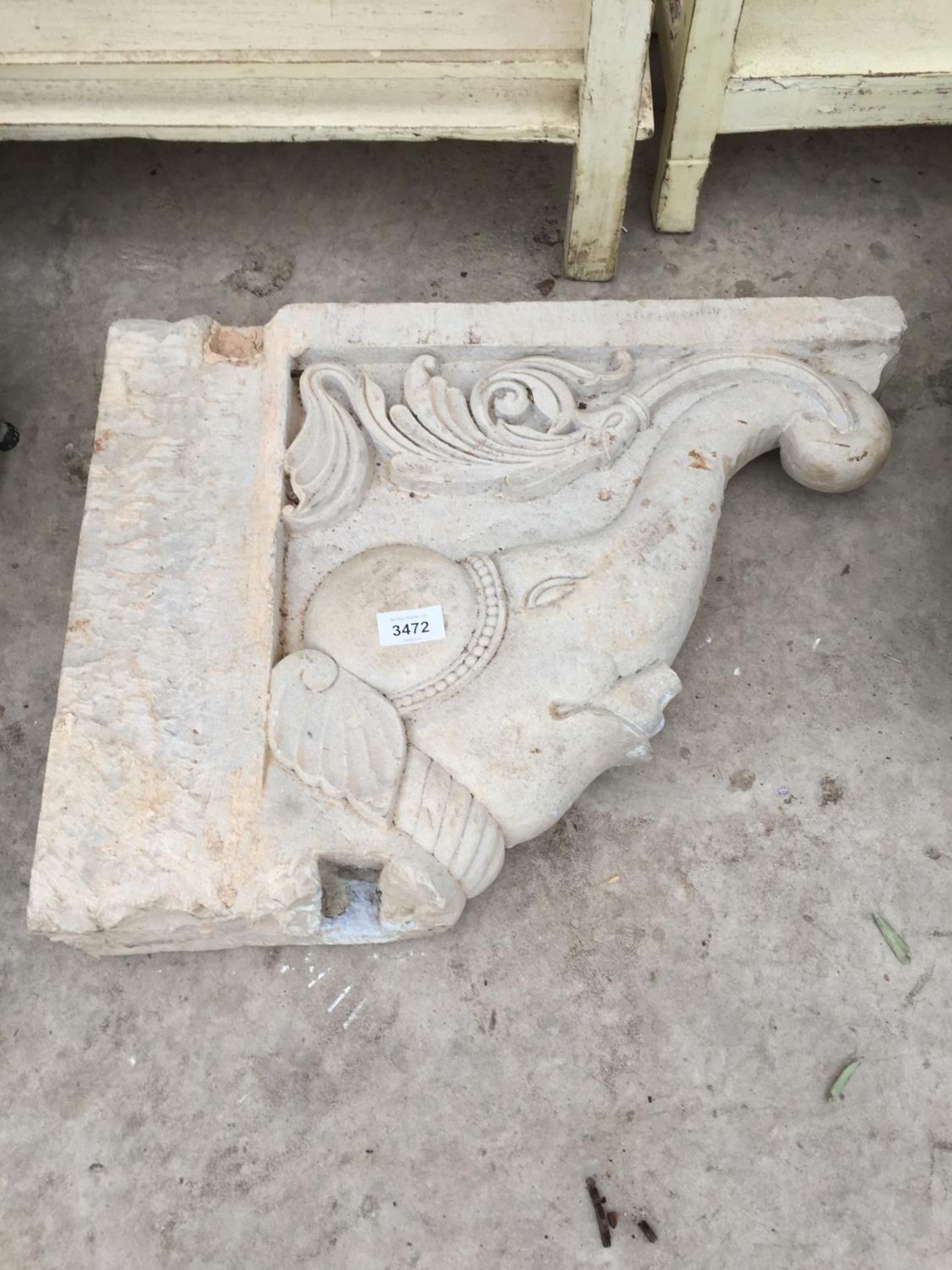 A CARVED INDIAN STONE BRACKETS WITH ELEPHANT CARVING