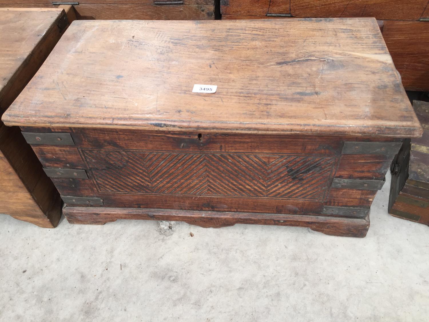 AN INDIAN HARDWOOD DOWRY CHEST WITH METAL STRAPS, 25" WIDE