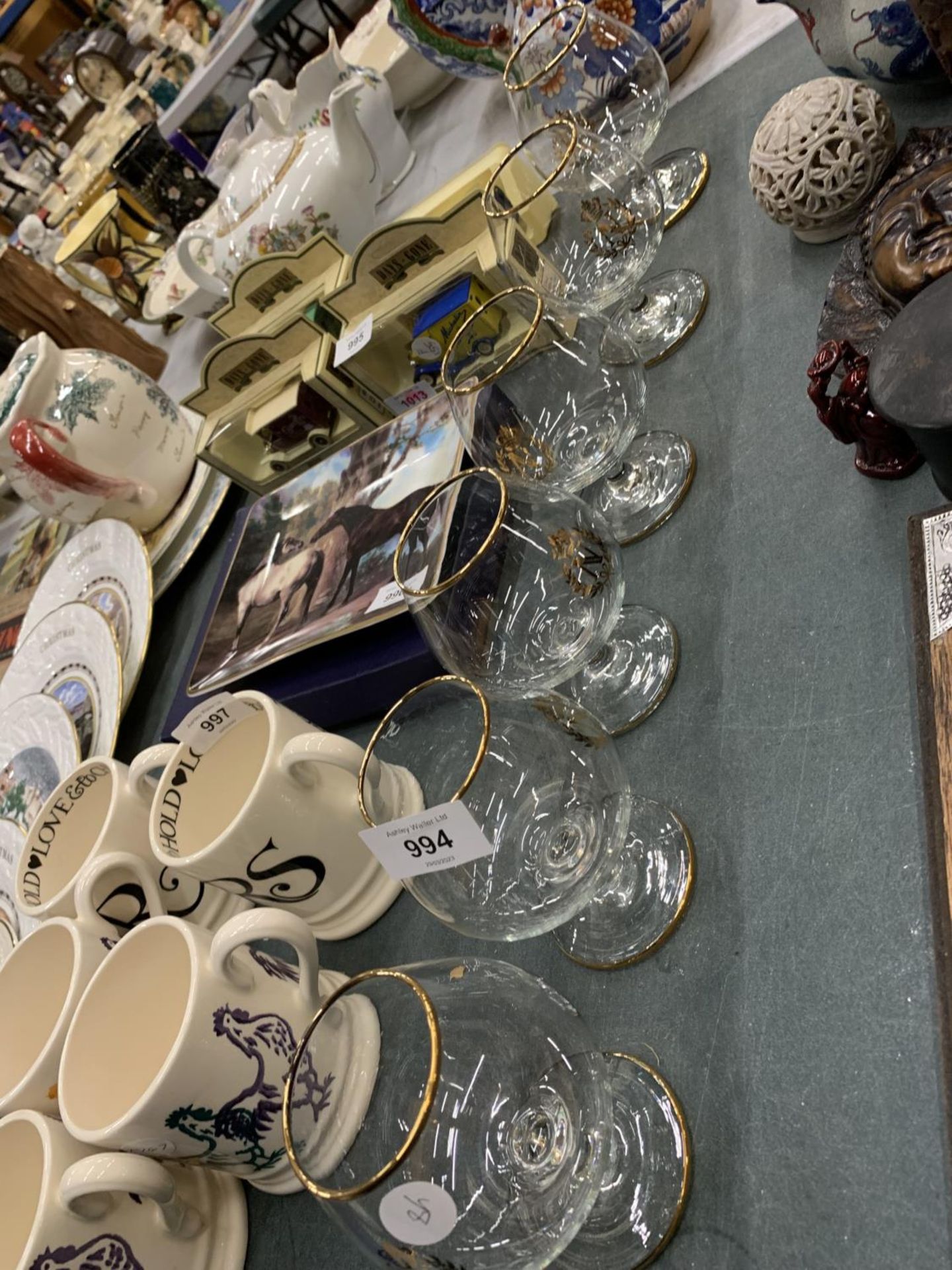 A SET OF BRANDY GLASSES WITH GOLD RIM AND EMBLEM