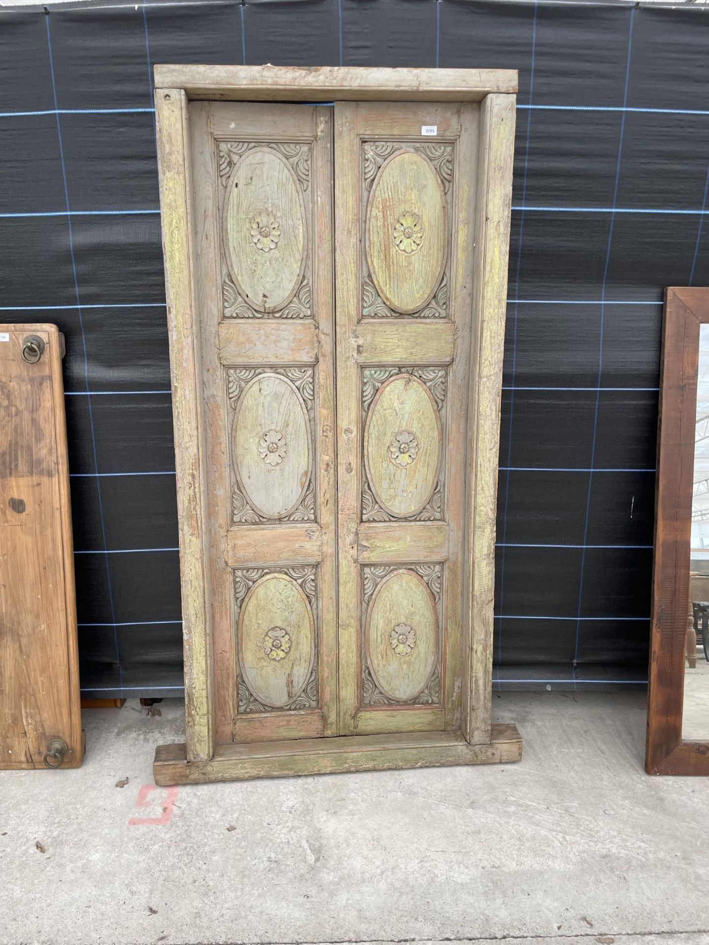 A PAINTED INDIAN HARDWOOD DOUBLE DOOR IN FRAME 34.5 X 74"