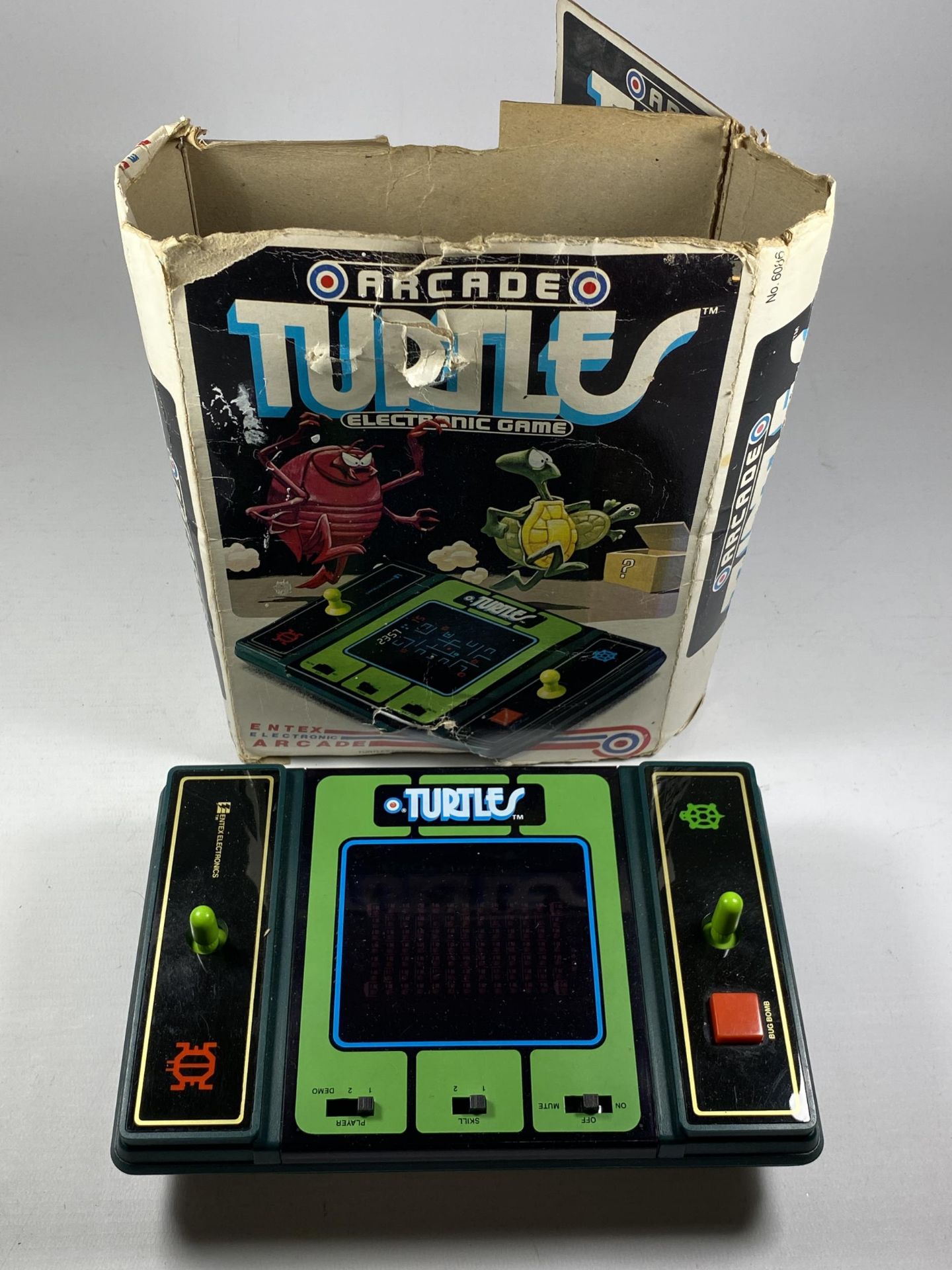 A RETRO BOXED ARCADE TURTLES ELECTRONIC GAME CONSOLE