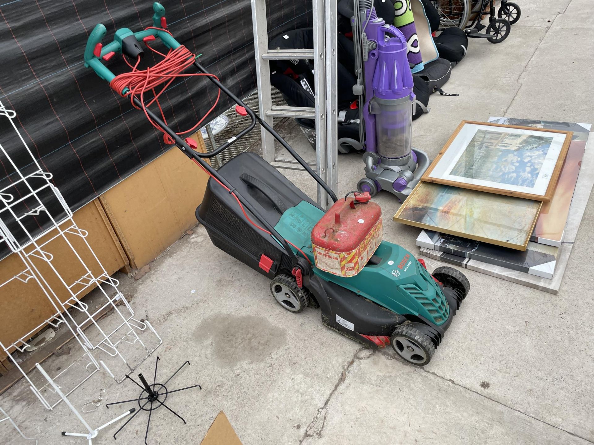 AN ELECTRIC BOSCH ROTAK 370ER LAWN MOWER WITH GRASS BOX AND A FUEL CAN