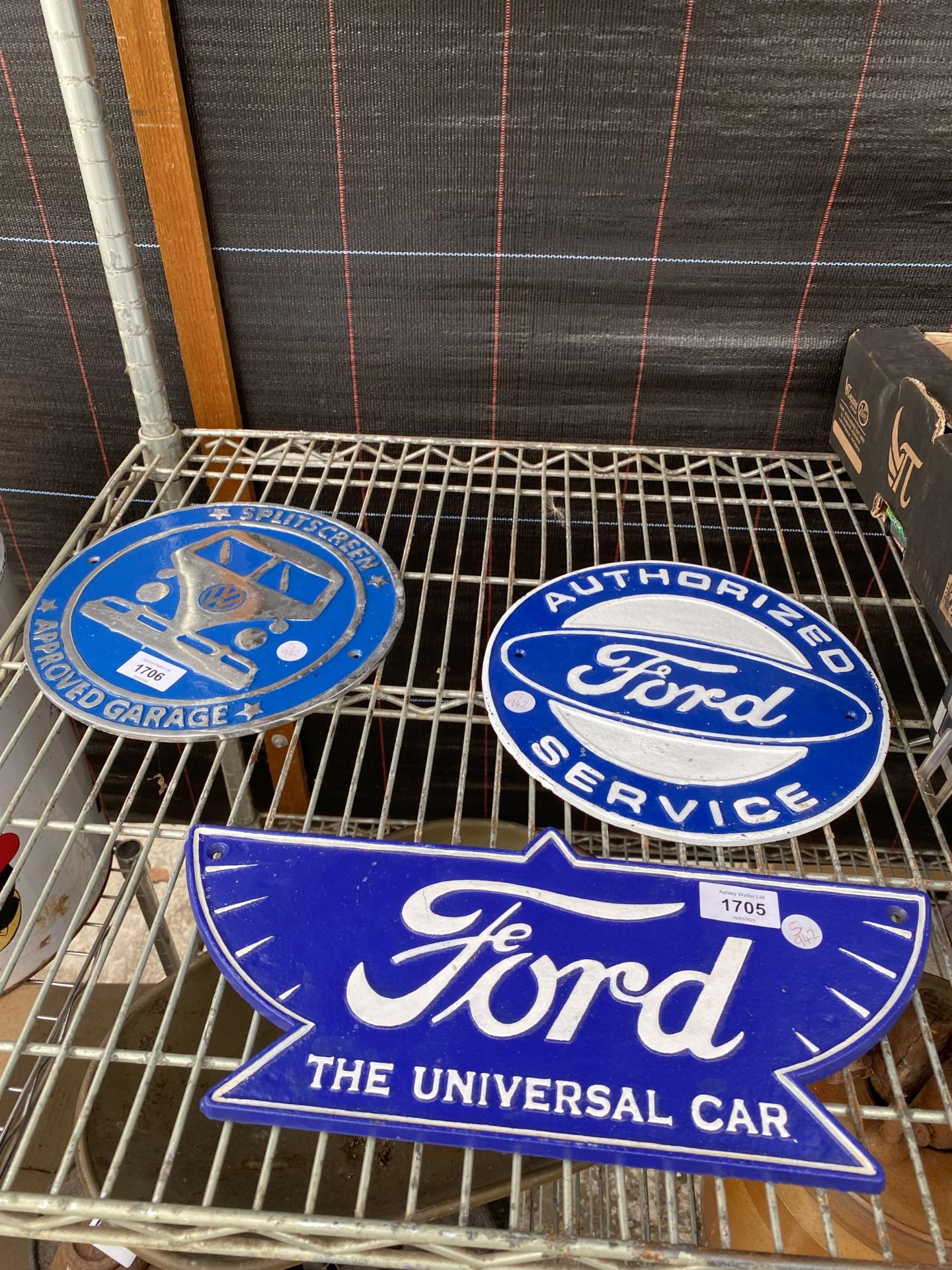 TWO BLUE CAST IRON FORD SIGNS